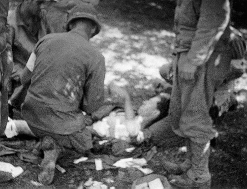 Battlefield surgeon treating a wounded German soldier.